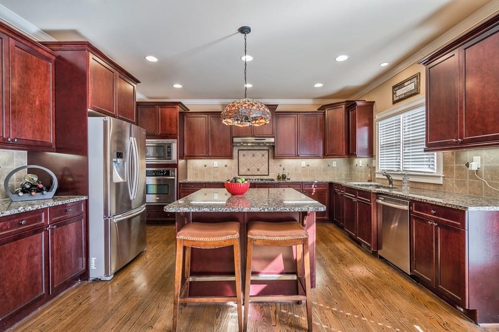 Enormous kitchen open to the family room*stainless