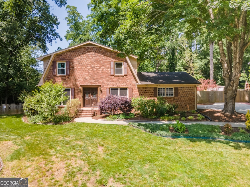 4-side brick colonial style sitting on a large .6 acre cul-de-sac lot.