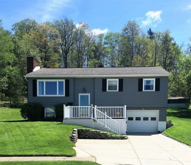 Rare find in the city!  Large .83 acre lot and wooded, private rear yard.  Nothing to do but move in!