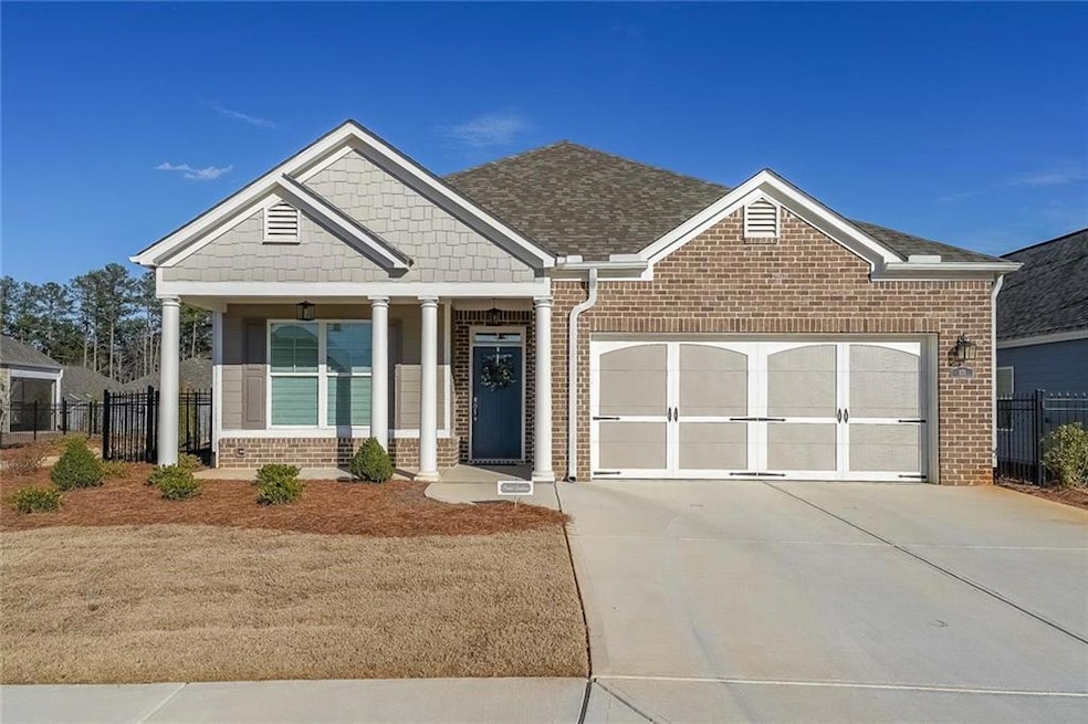 Craftsman-style home with brick siding, concrete d