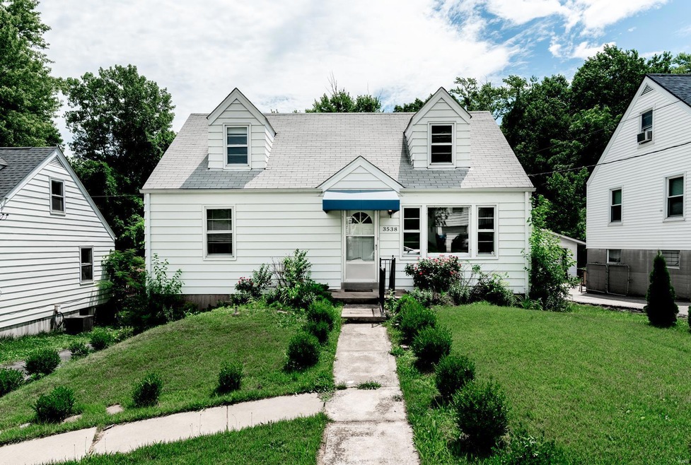 Cute dormer windows in the second floor of this charming bungalow!