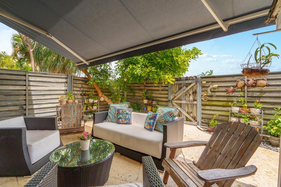 Fully fenced, private patio with retractable awnin