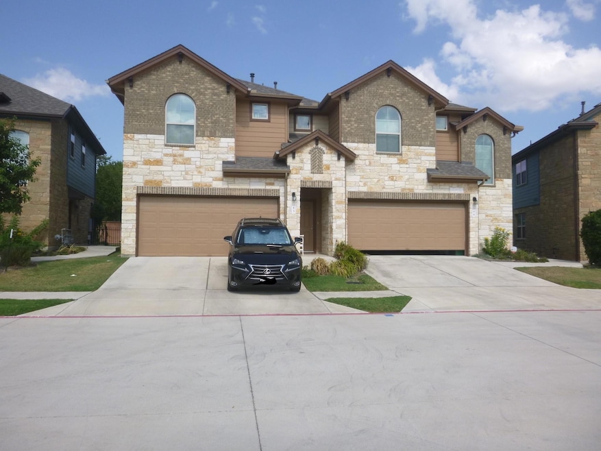 View of front of property featuring stone siding,