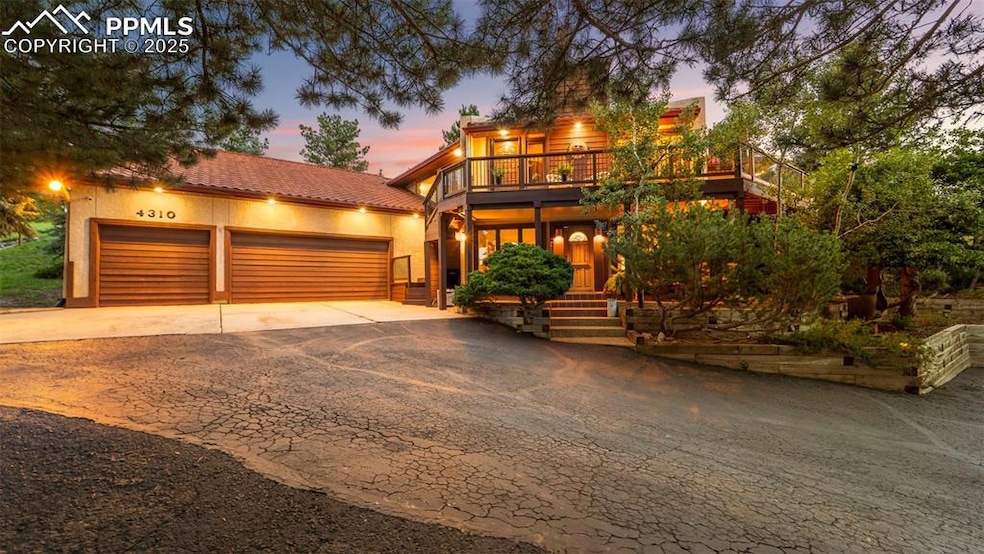 At twilight, this front facade of a retreat-style home glows warmly, its architectural lines softened by the fading light.