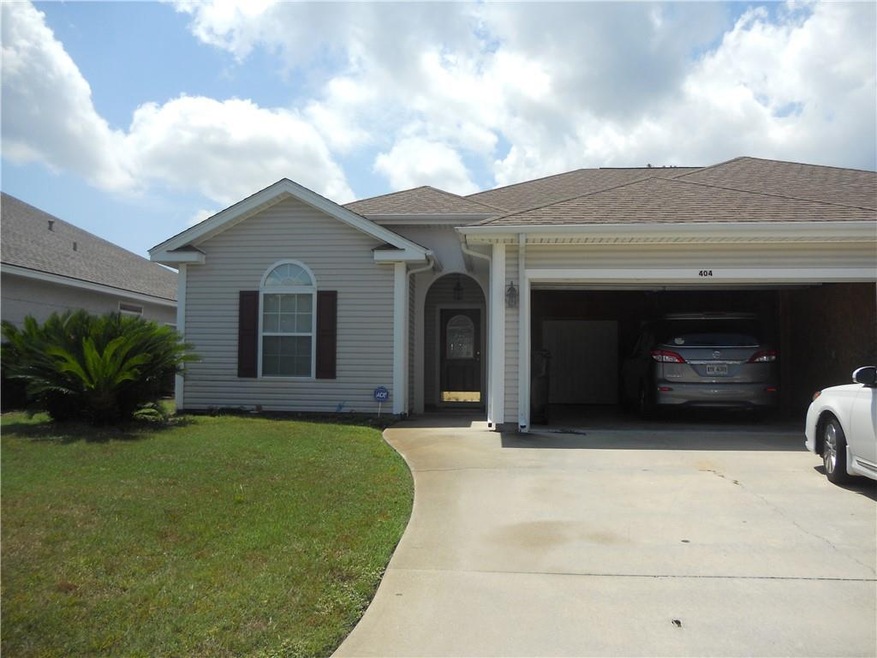 404 Cobblestone front view with garage open