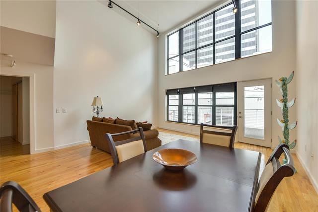 The living room with its wall of windows opens to the 282 sq foot balcony.