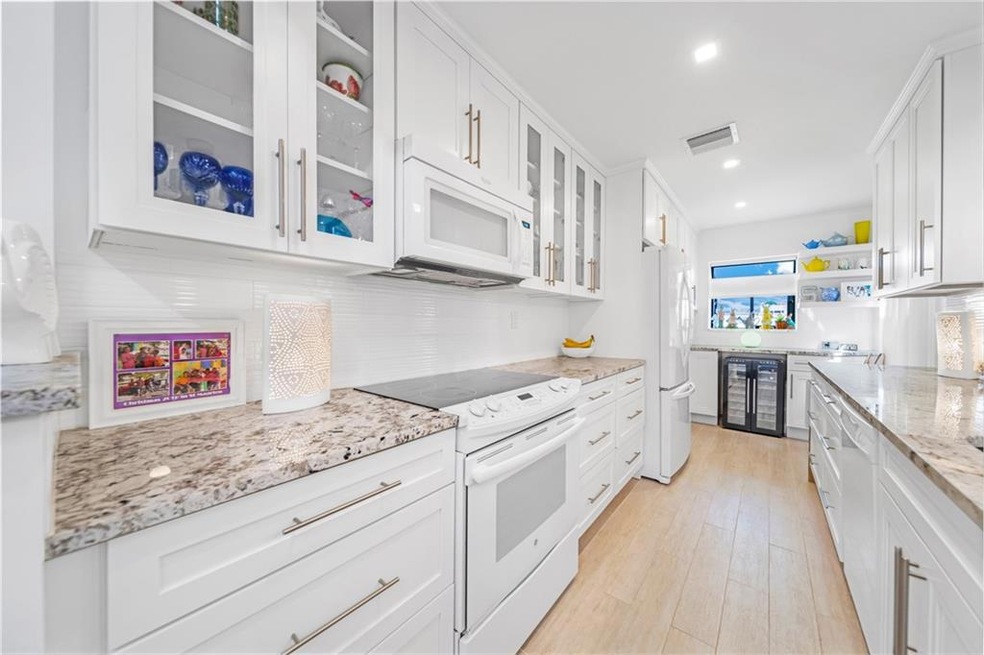 Fully updated open kitchen with granite counter to