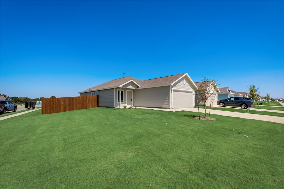 View of home's exterior with concrete driveway and an attached garage
