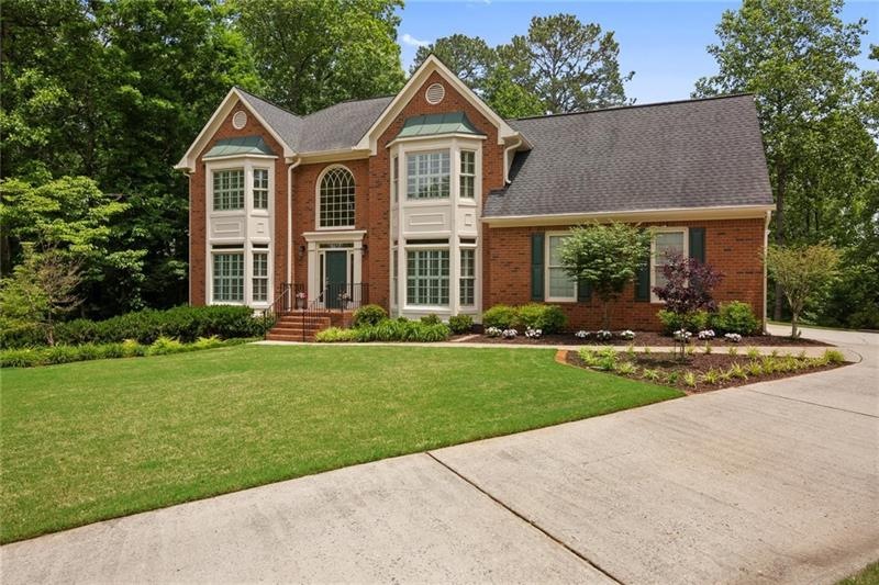 Gorgeous brick traditional on a cul-de-sac in swim
