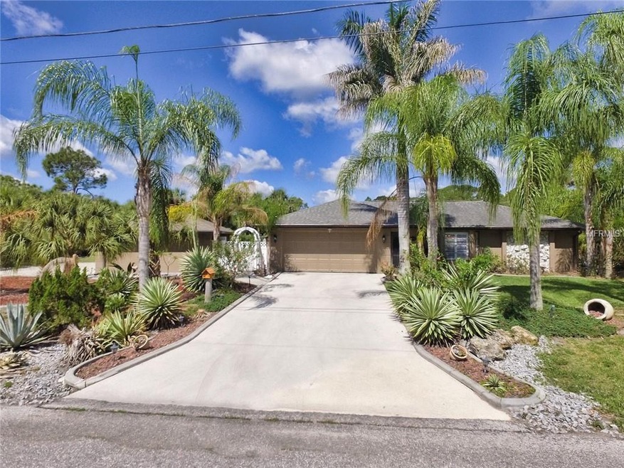 Street view - detached garage at left