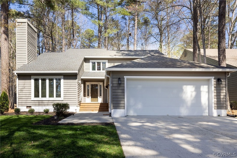 View of front of property featuring a garage and a