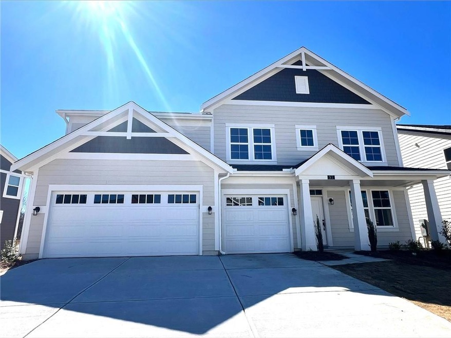 View of front facade with concrete driveway