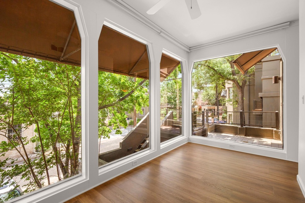 Unfurnished sunroom with wood finished floors and