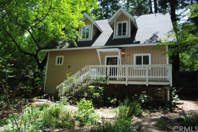 Front of home w/dormer windows and garden