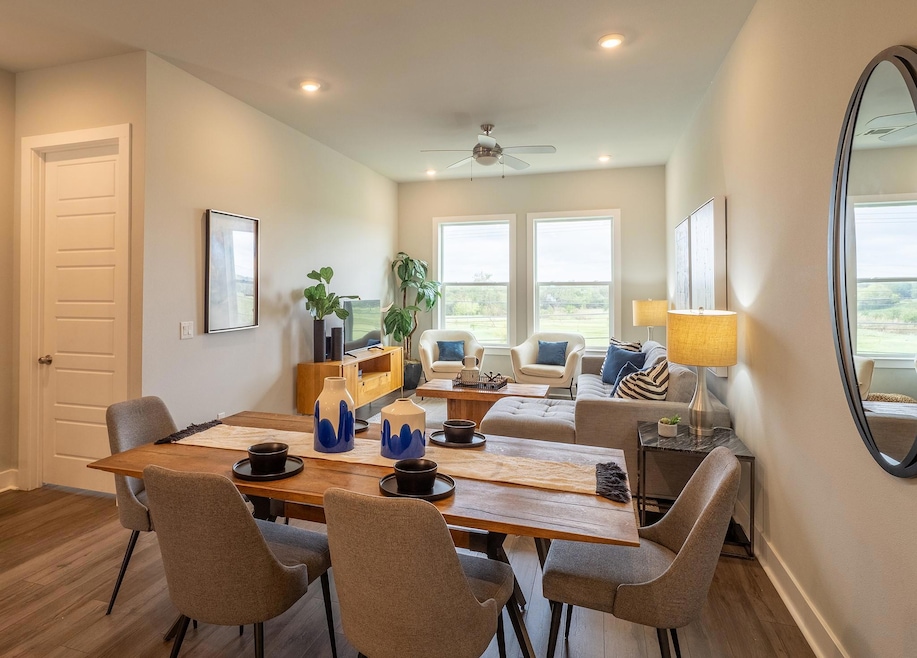 Dining space featuring wood finished floors, recessed lighting, and ceiling fan