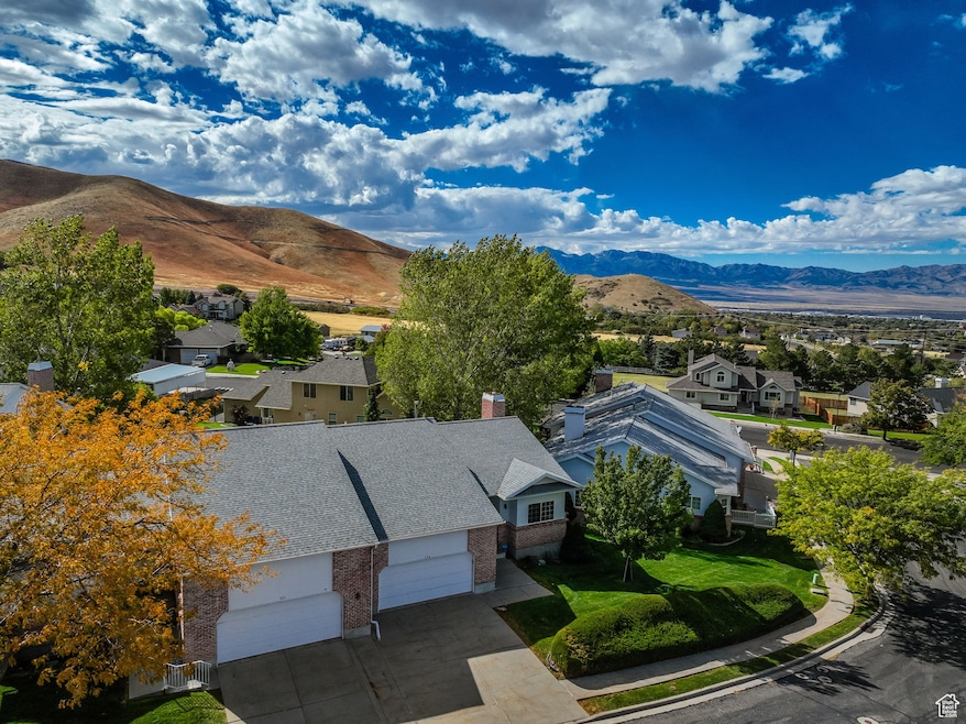 Aerial perspective of community with mountains.