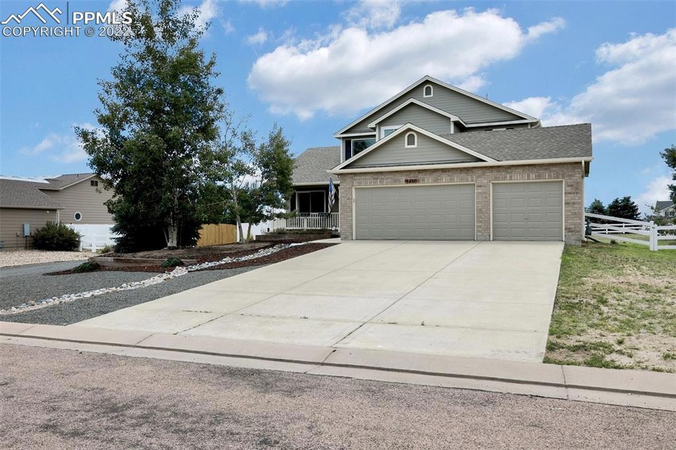 Front of Home-Zero scaped w/Drive on the left & Do