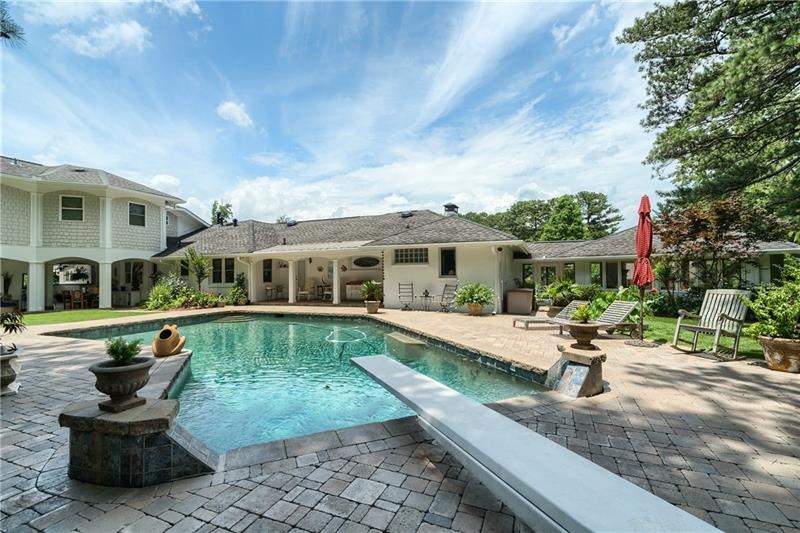 Heated salt-water pool and beautiful gardens make 