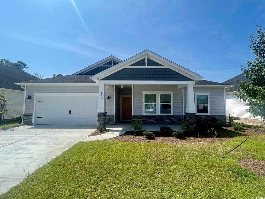 Craftsman house featuring a garage and a front yar
