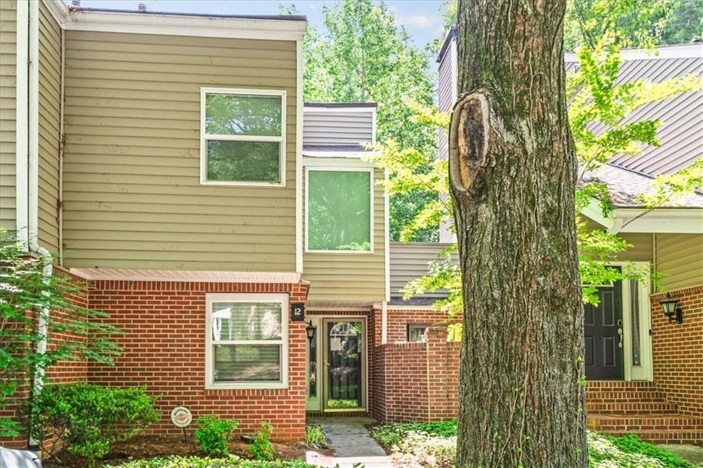 Rear view of property featuring brick siding