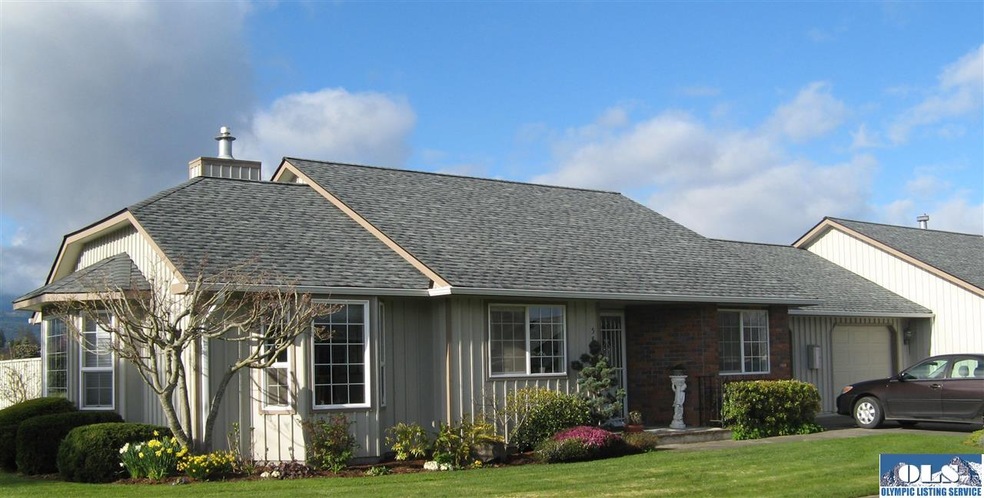 New roof is evident, brick trim at entrance, bay w