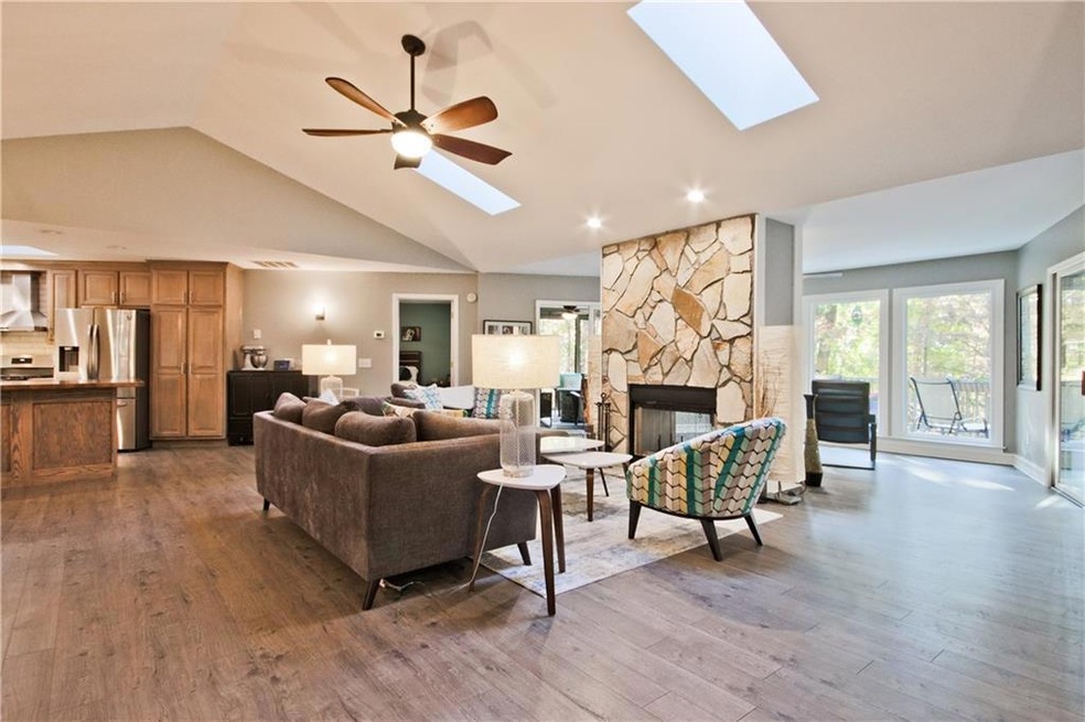 Great room featuring two living areas divided by a