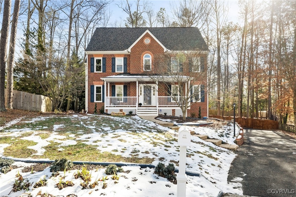 Colonial house featuring a porch