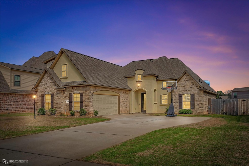 French country inspired facade with fence, drivewa