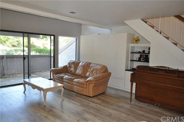 Open family room with brand new wood-look vinyl fl