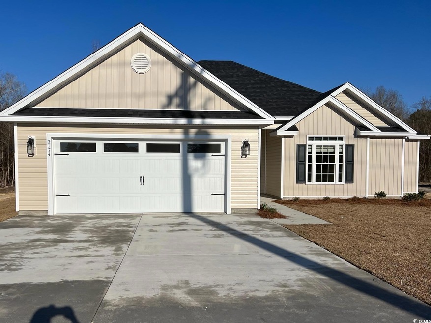 View of front of property with a garage, driveway,