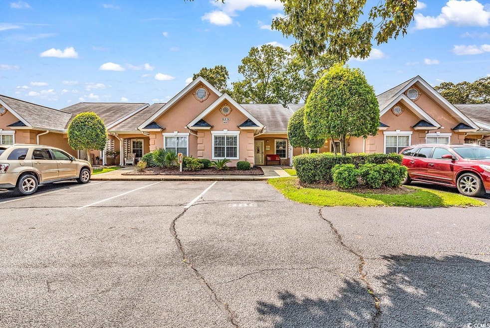 View of front of home featuring uncovered parking 