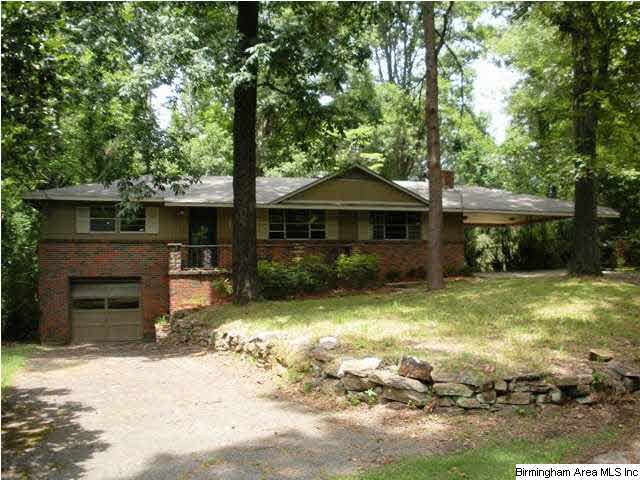 Nestled on a shaded private fenced lot at the end 