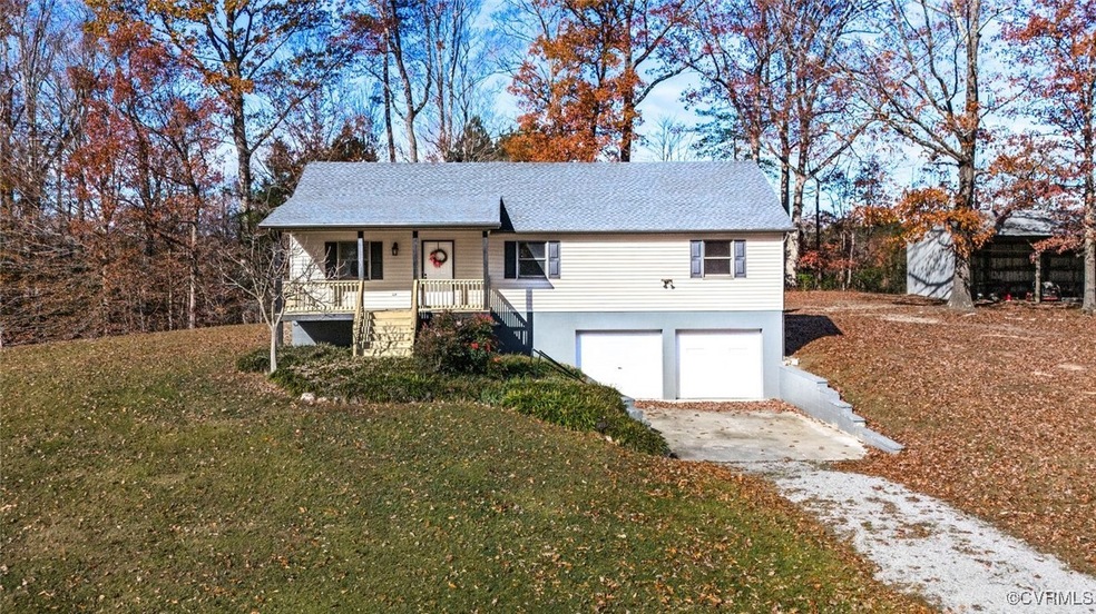 View of front facade with a front lawn, a porch, a