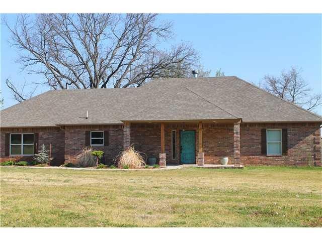 Exterior Front. Custom home on over 8 acres.