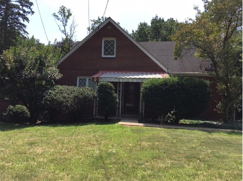 This great brick home has it all!!!  First floor l