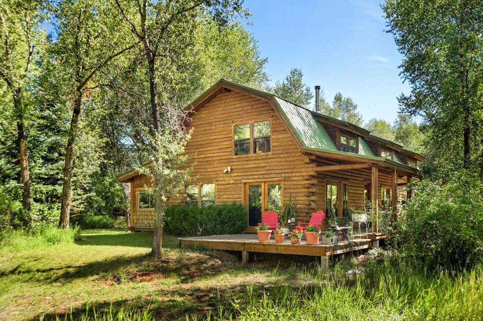 Log Cabin on the River in Basalt