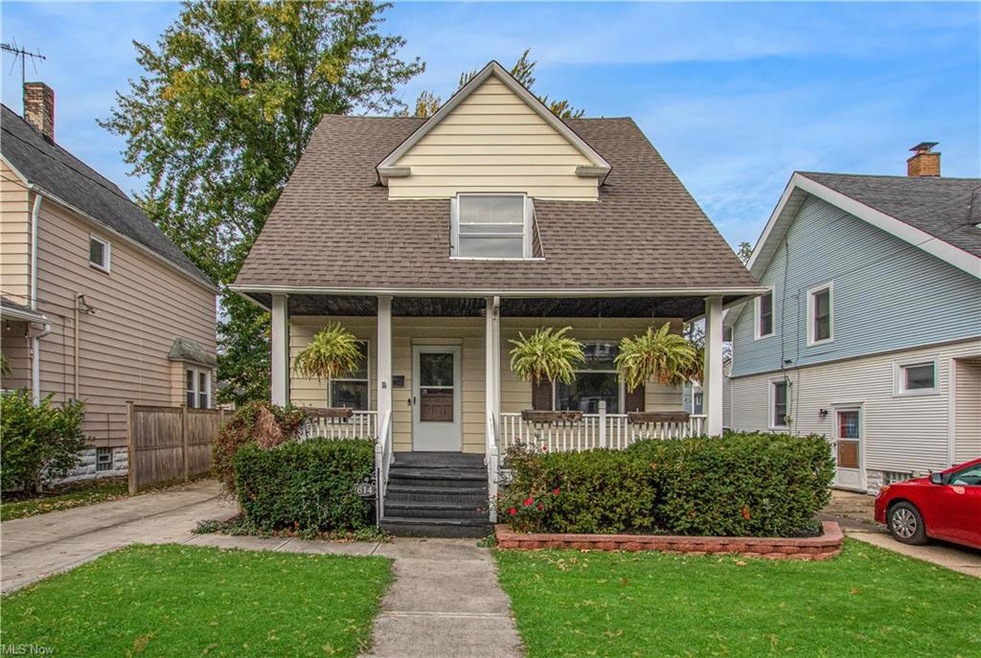 Colonial-style home featuring covered porch