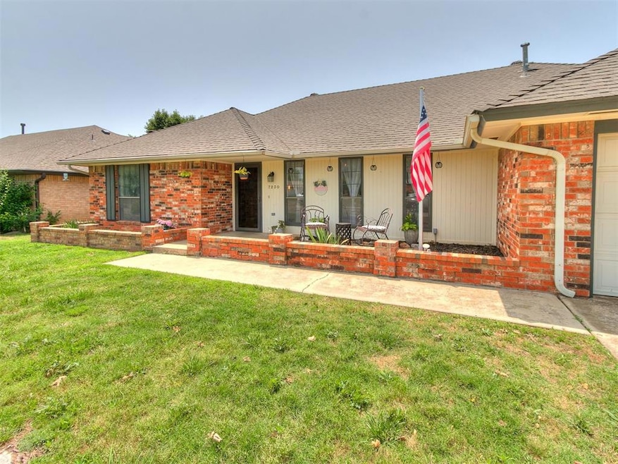 Ranch-style house featuring brick siding, a front yard, an attached garage, and a shingled roof