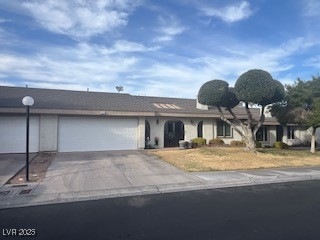 Single story home with an attached garage and driv