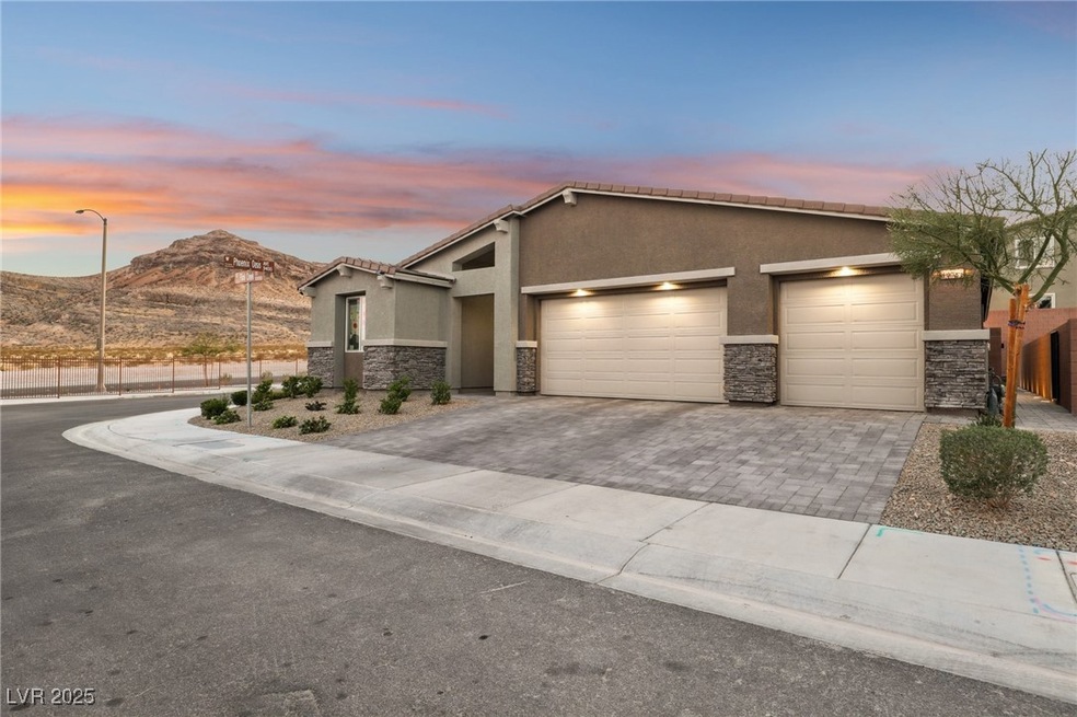 View of front of home featuring driveway, stucco s