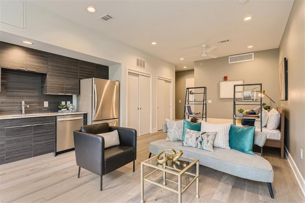 Living area with light wood-style floors, recesse