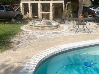 Swimming pool with a patio