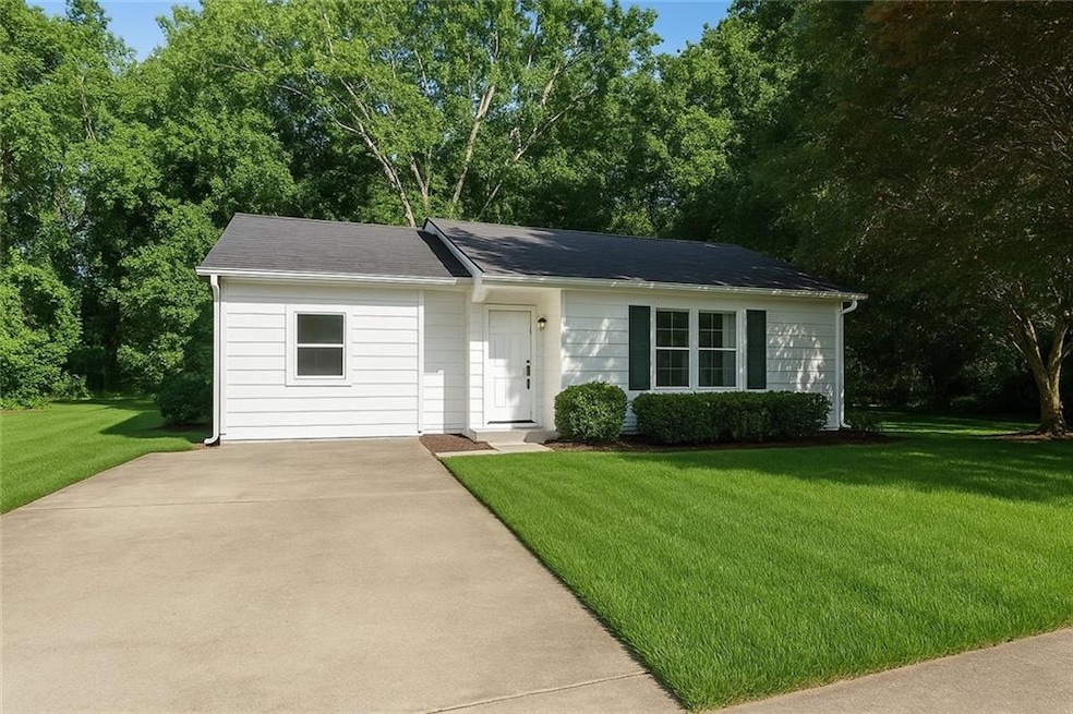 Ranch-style house with a front lawn