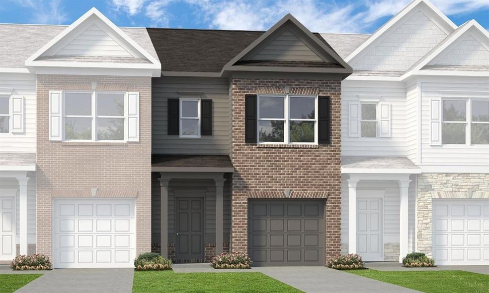 Townhome / multi-family property featuring a front
