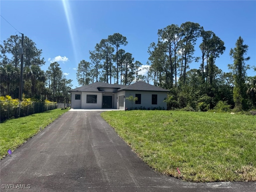 View of front of property aphalt driveway