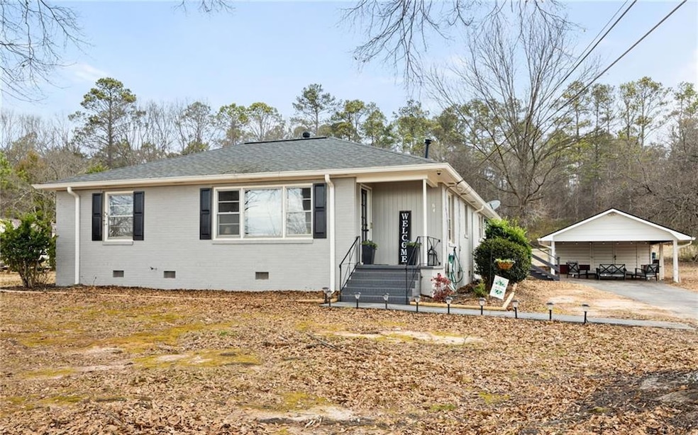 Bungalow-style house featuring a carport