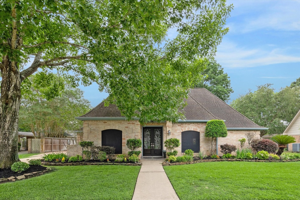 2 story brick home with solar screens, lush landsc