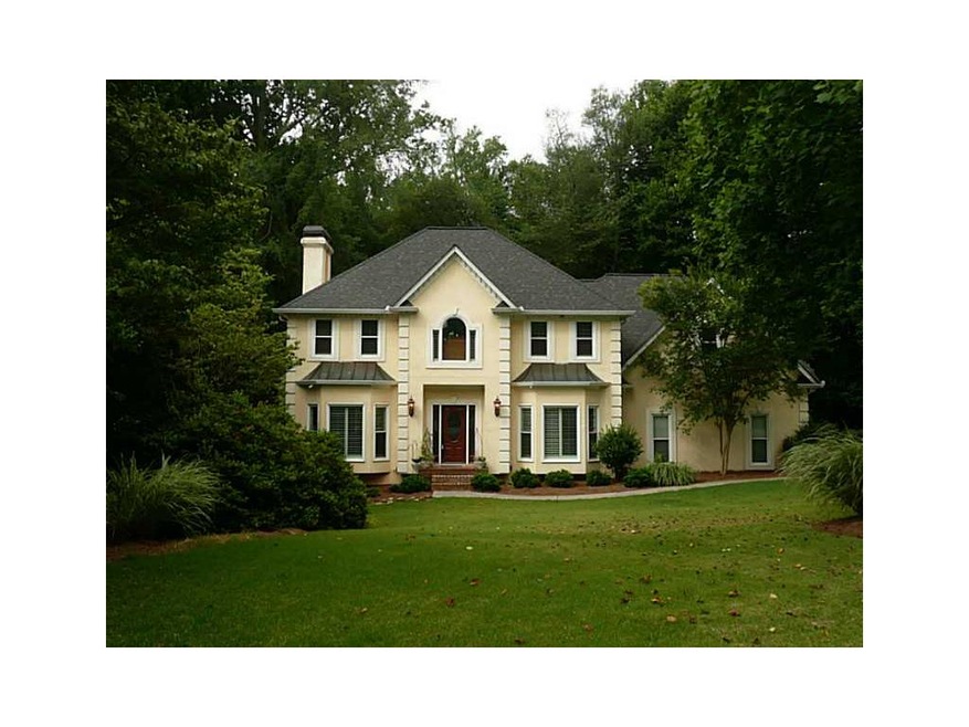 Exterior Front. 3 SIDED HARDCOAT STUCCO  ESTATE ON