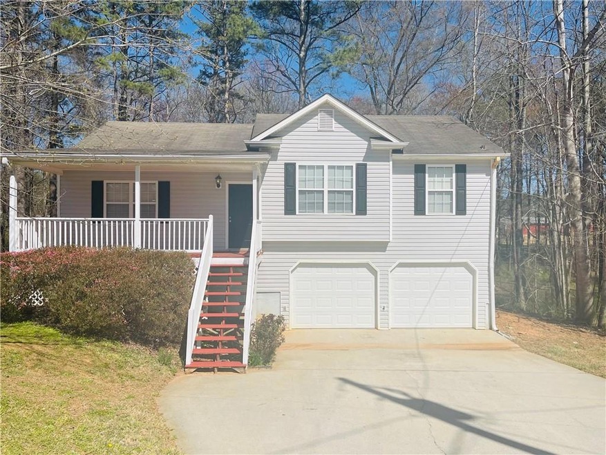 View of front facade featuring covered porch, conc
