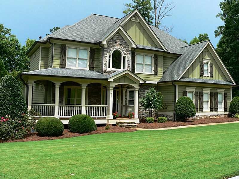 Exterior Front. Fabulous home with wrap-around por